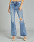 Blue jeans with a distressed design on a gray background