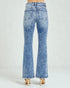 Light blue flared jeans on a white background