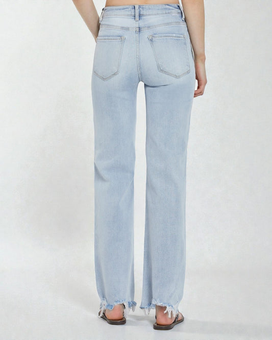 Light blue jeans worn by a person on a white background