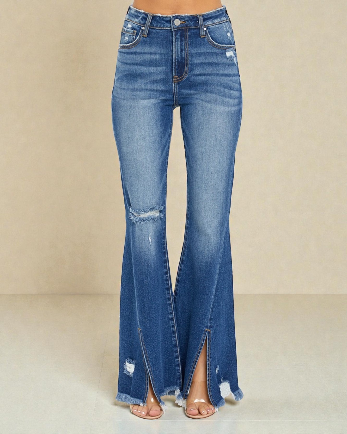 Blue flared jeans with a slit on a beige background