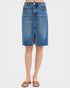 Blue denim skirt worn by a person on a white background