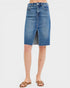 Blue denim skirt worn by a person on a white background
