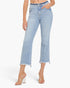 A model wearing light-wash blue cropped denim jeans with a frayed hem and side pockets, paired with clear high-heeled sandals, against a plain white studio background.