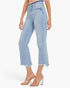 A model wearing light blue cropped denim jeans with a raw frayed hem and clear high-heel mules, shown against a plain white studio background.