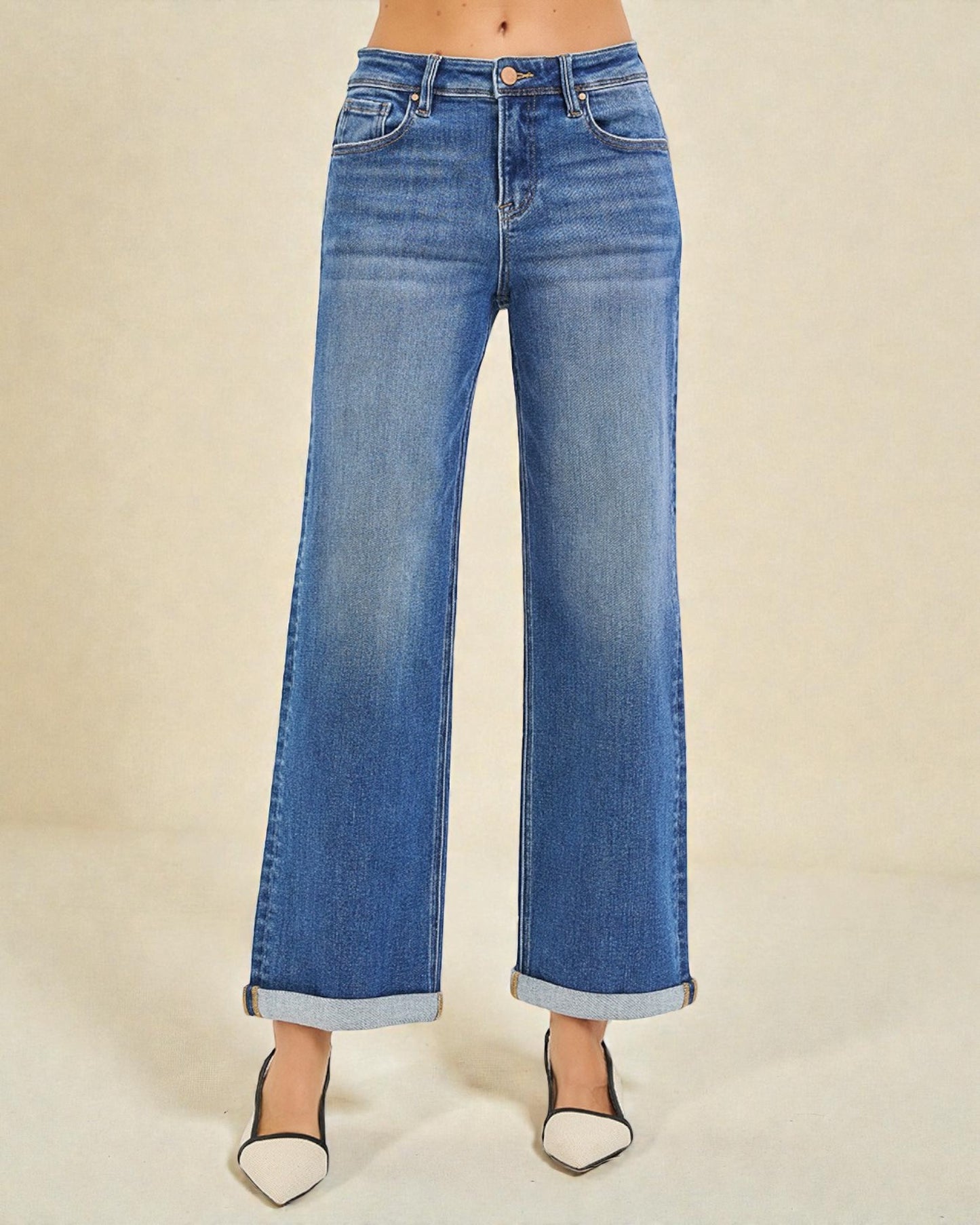 Blue jeans with a beige background