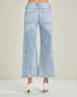 Light blue wide-leg jeans worn by a person on a white background