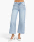Light wash blue cropped wide-leg jeans shown on a model from the waist down, paired with white pointed-toe heels against a clean white studio background.