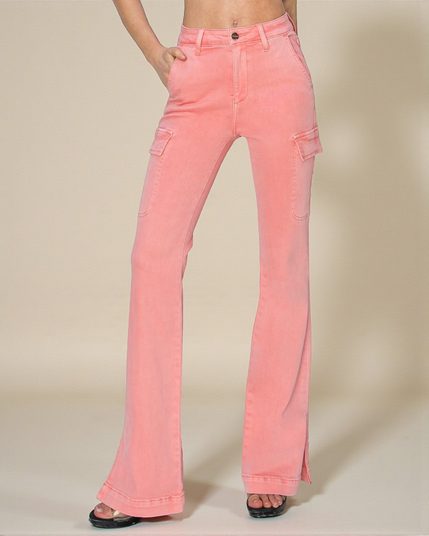 Pink flared jeans on a beige background