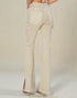 Beige pants worn by a person on a plain background
