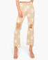 A model wearing beige cropped jeans with a white star print, distressed rips at the knees, and frayed hems, paired with clear high-heeled sandals against a light gray background.