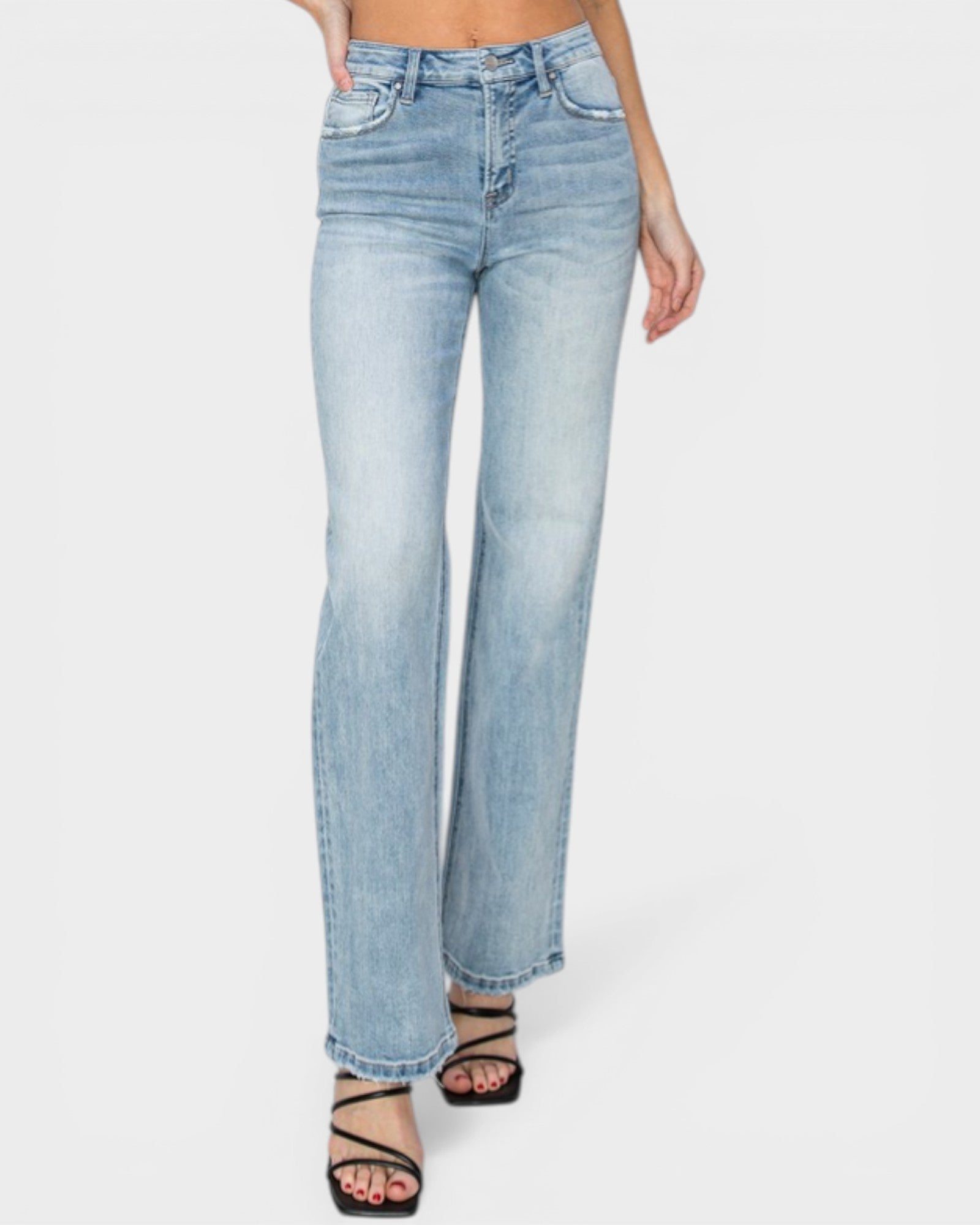 Light blue jeans worn by a person on a white background