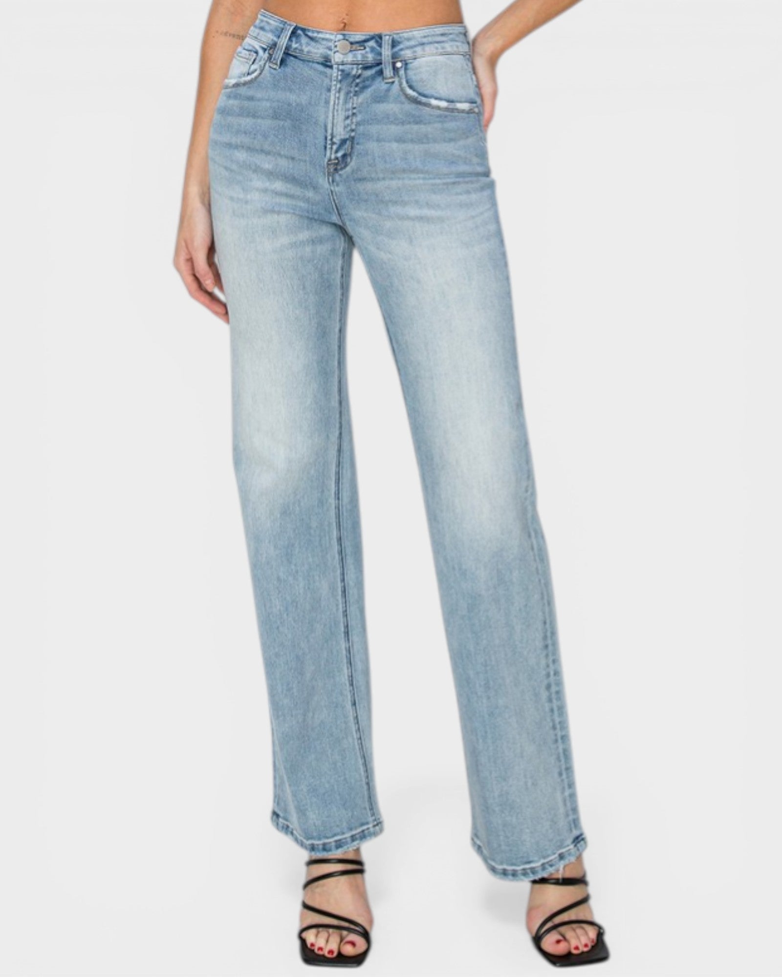 Light blue jeans worn by a person on a white background