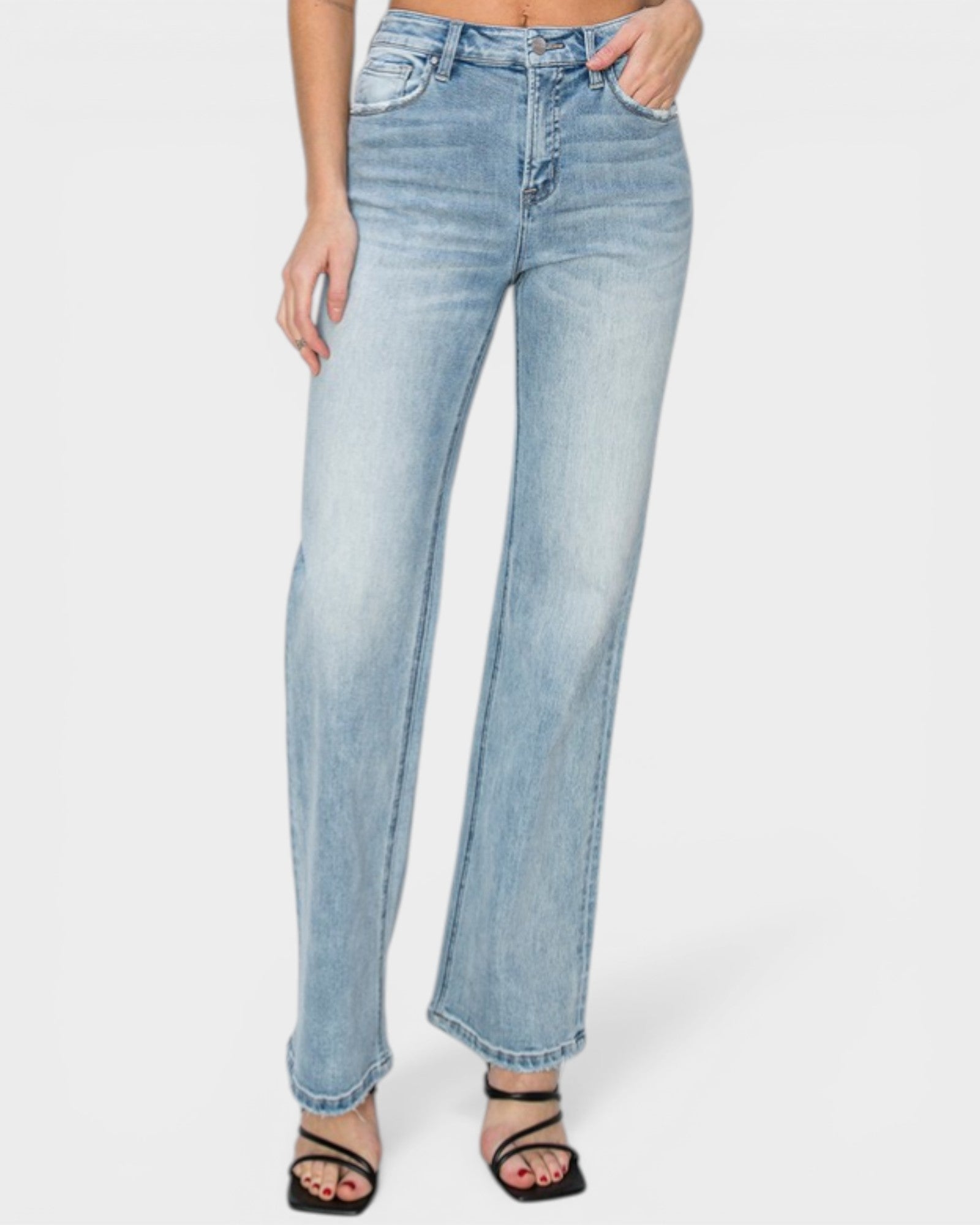 Light blue jeans worn by a person on a white background