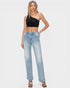 Woman wearing a black crop top and light blue jeans on a white background