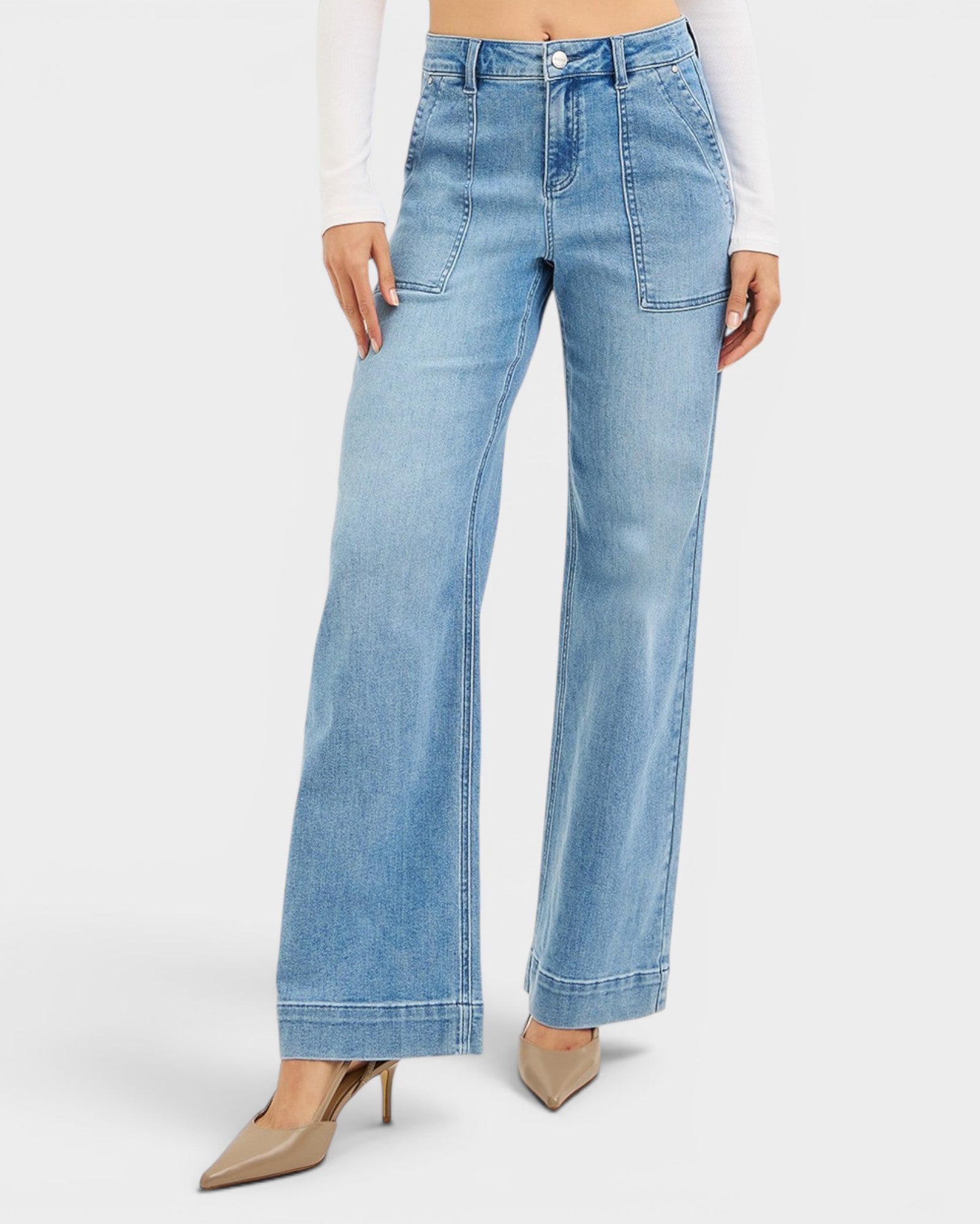 Light blue jeans worn by a person on a white background