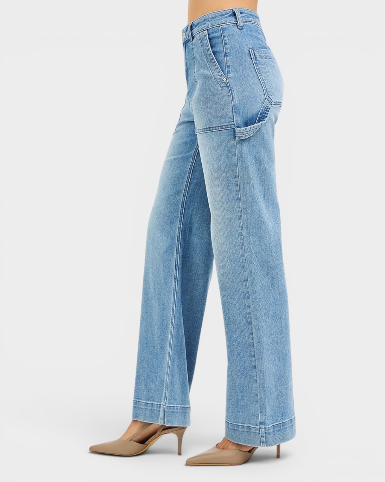 Light blue jeans worn by a person on a white background