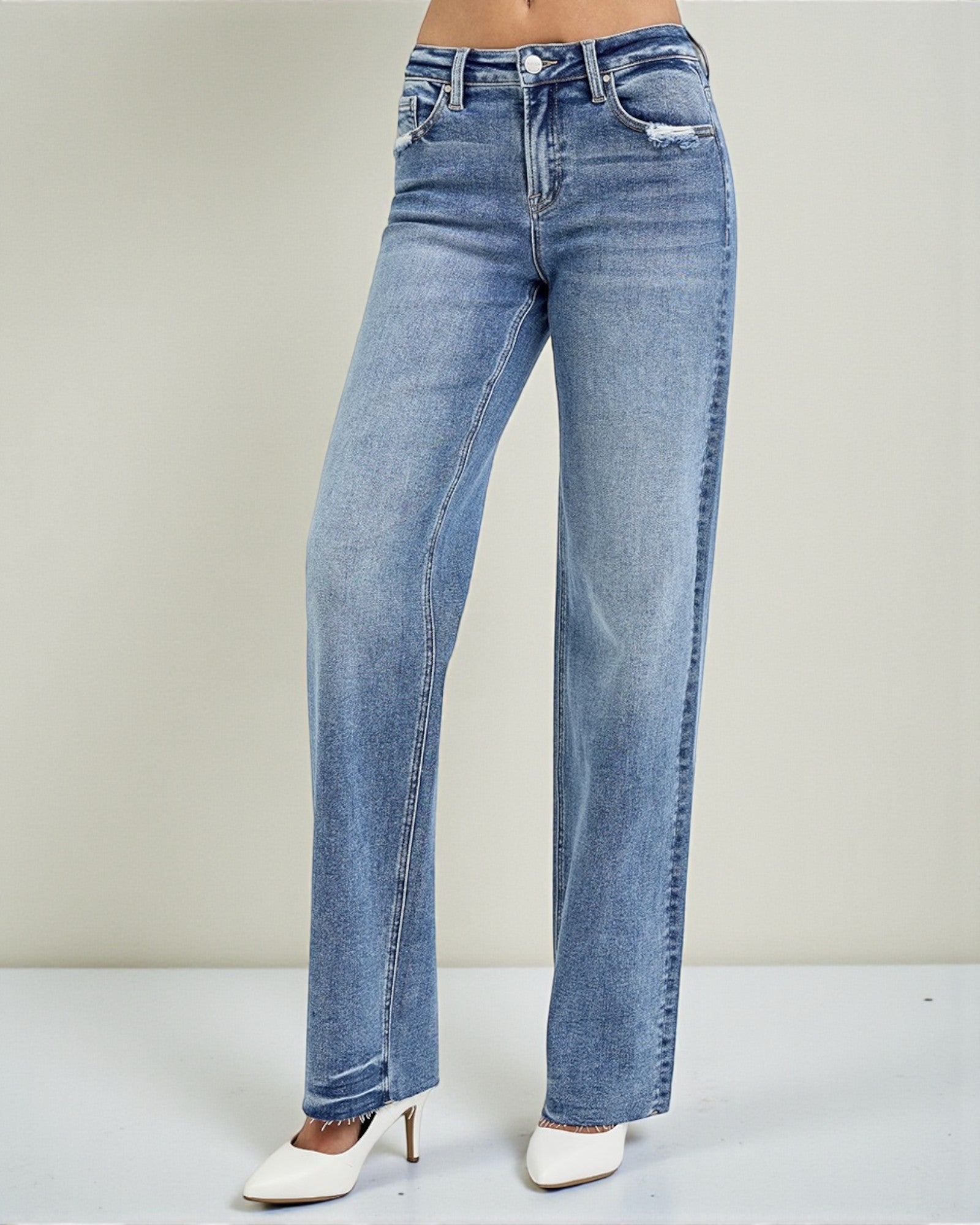 Blue jeans on a plain background