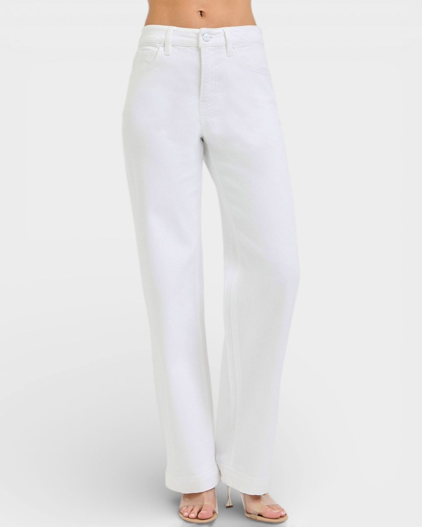 White jeans worn by a person on a white background