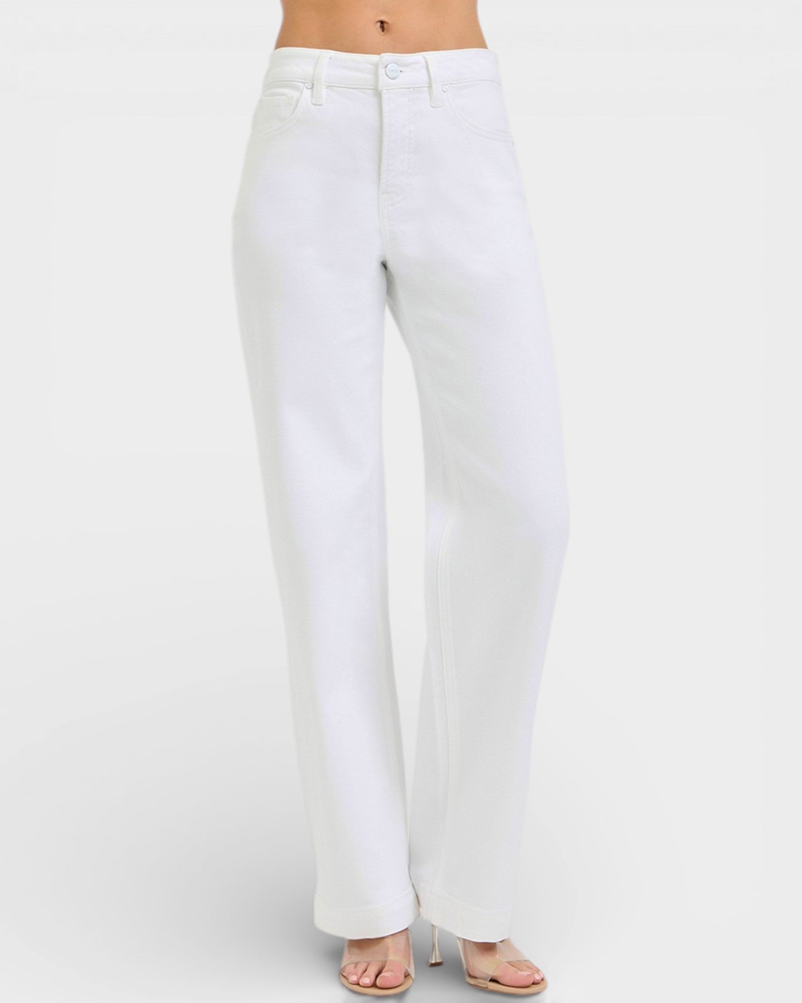 White jeans worn by a person on a white background