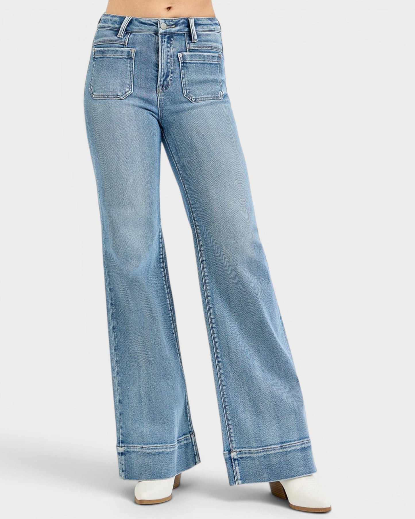 Light blue flared jeans on a white background