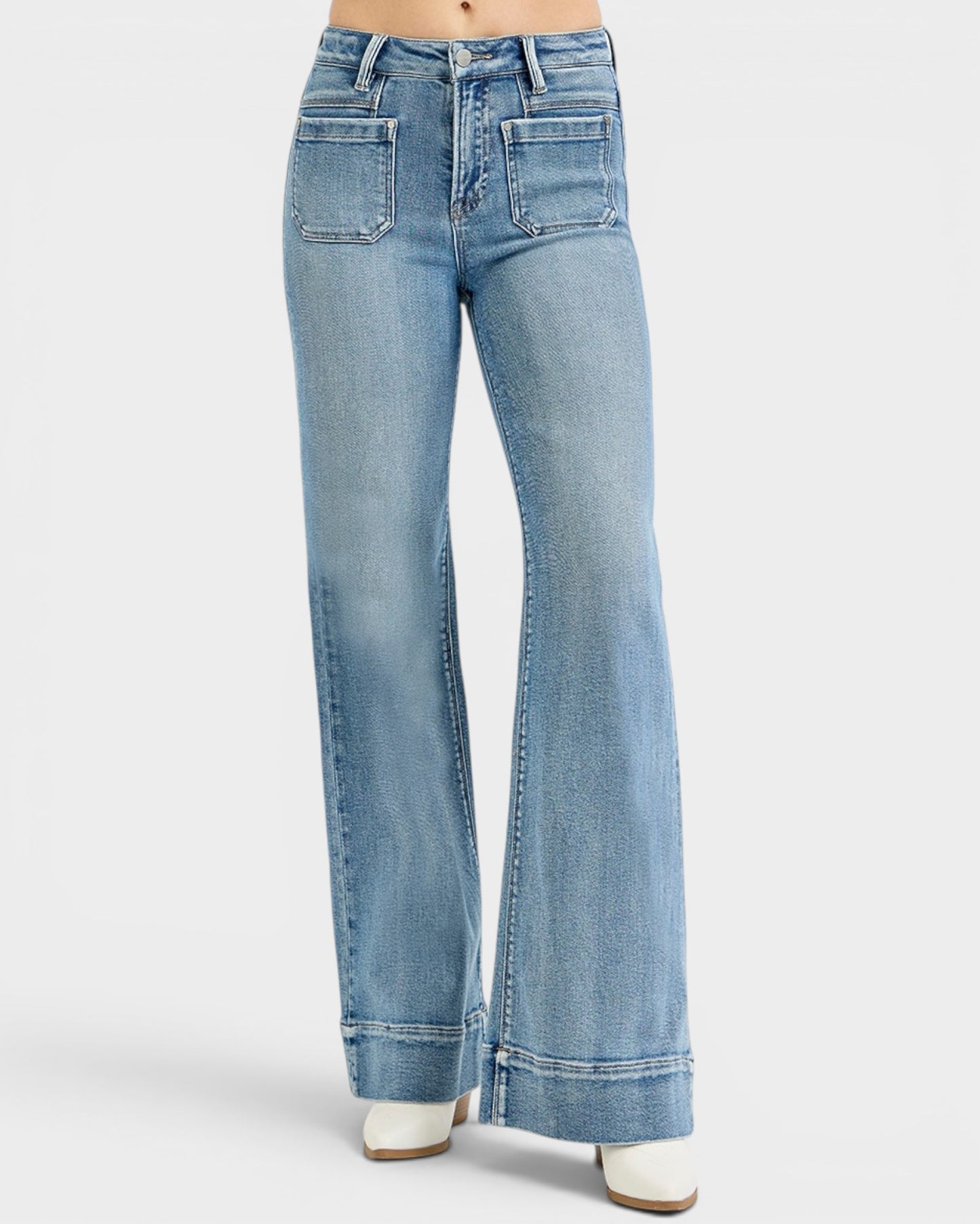 Light blue flared jeans on a white background