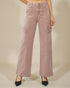 Pink cargo pants worn by a person on a beige background