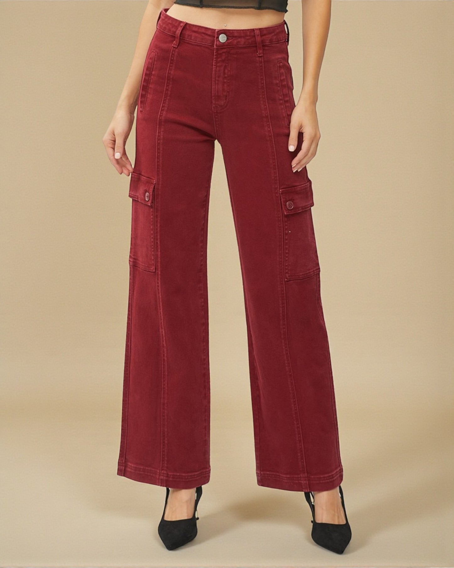 Red wide-leg pants worn by a person on a beige background