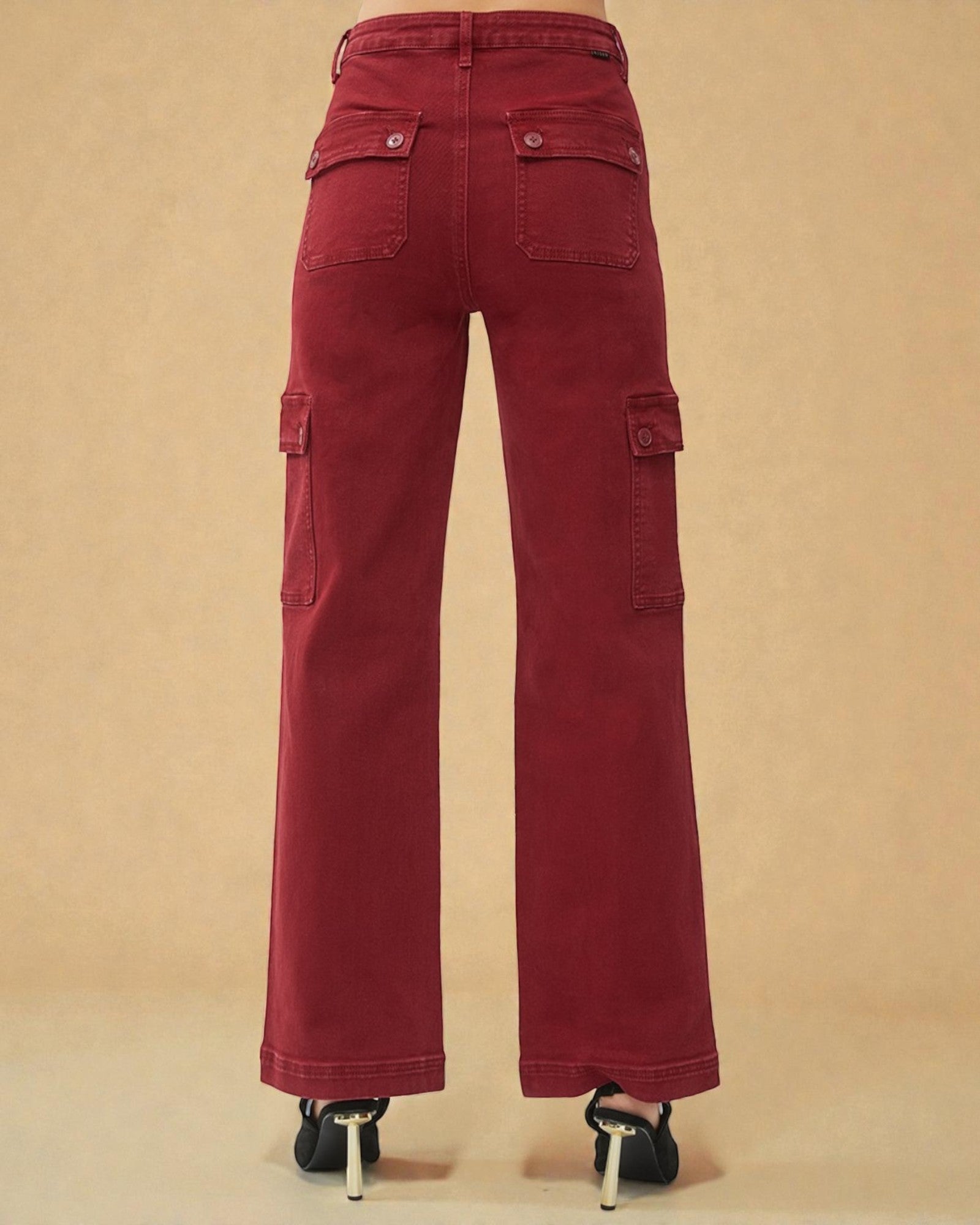 Red cargo pants on a beige background
