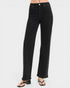 Black jeans worn by a person on a white background