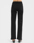 Black jeans worn by a person on a white background