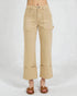 Beige pants worn by a person on a white background