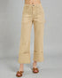 Beige pants worn by a person on a gray background