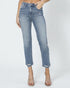 Person wearing light blue jeans on a white background