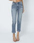 Light blue jeans worn by a person on a white background