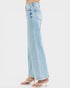 Light blue jeans worn by a person on a white background