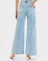 Light blue wide-leg jeans worn by a person on a white background