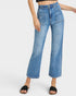 Blue jeans worn by a person on a white background