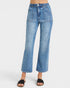 Blue jeans worn by a person on a white background