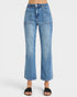 Blue jeans worn by a person on a white background