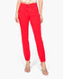 A model wearing bright red ankle-length pants with a gathered elastic hem, paired with clear heeled sandals and a floral top, shown against a plain white background.