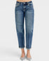 Blue jeans worn by a person on a white background