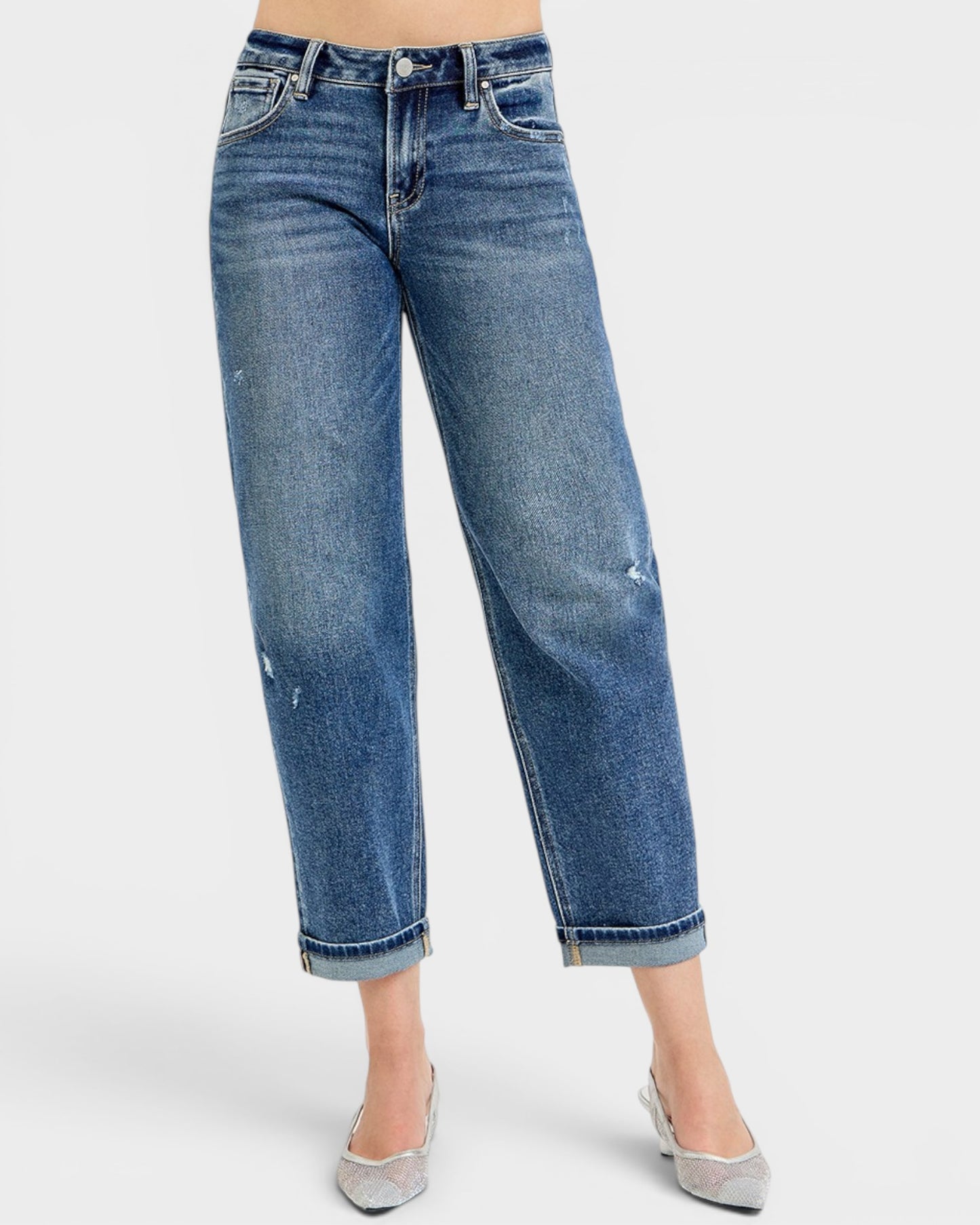 Blue jeans worn by a person on a white background