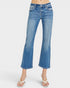Blue jeans worn by a person on a white background