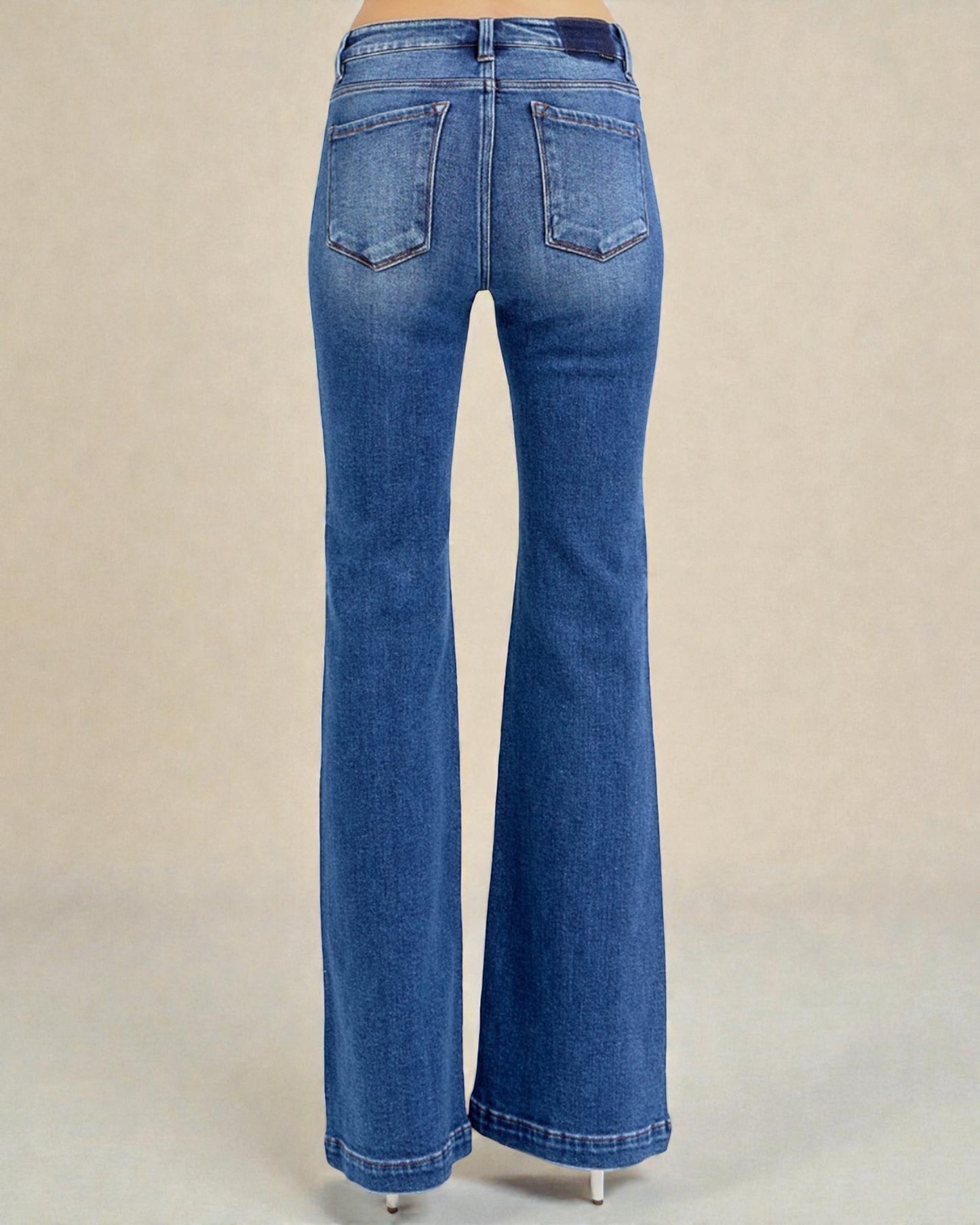 Blue jeans on a beige background