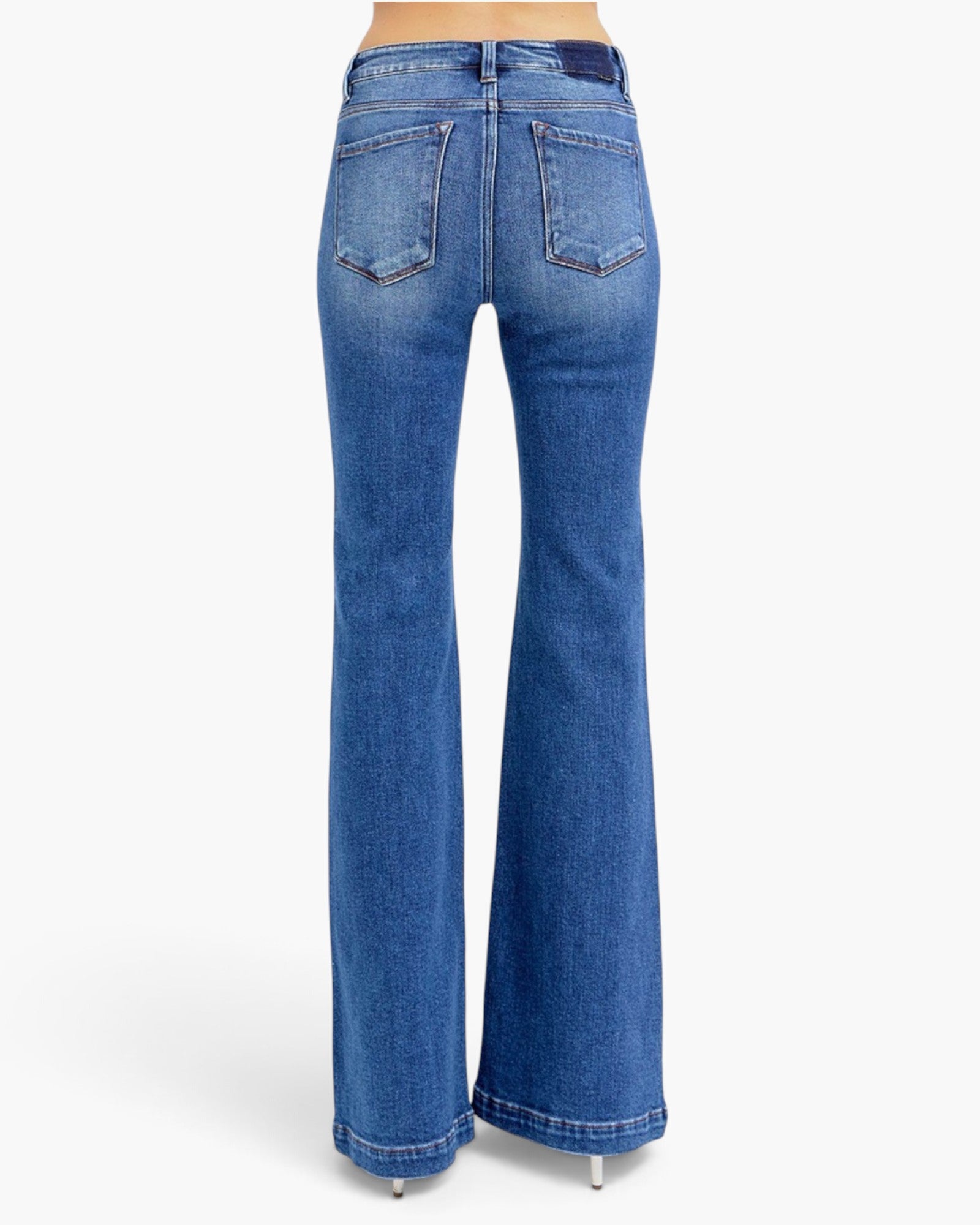 Blue high-waisted flare jeans shown from the back on a model, featuring a classic five-pocket design and a flared leg, photographed against a clean white background.