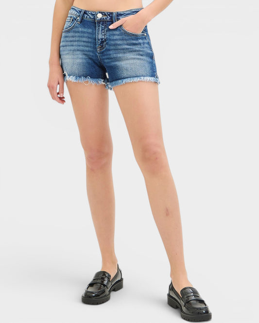 Person wearing blue denim shorts on a white background