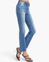 A model's lower body wearing a pair of medium-wash blue denim jeans with a slight flare at the hem and black strappy high-heeled sandals, shown against a plain white studio background.