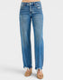 Blue jeans with distressed details on a white background