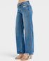 Blue jeans worn by a person on a white background