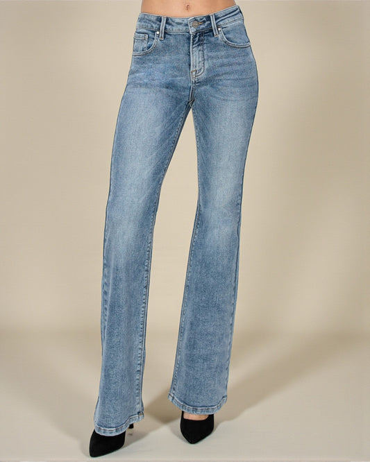 Light blue jeans on a beige background